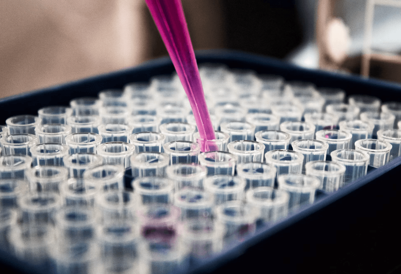 Photo of research with test tubes