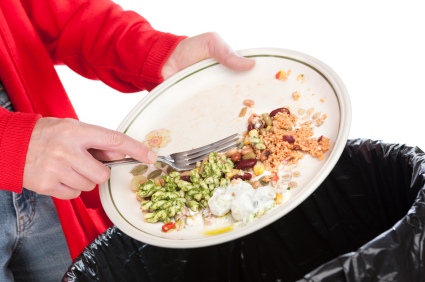 JVS image - man throwing leftover food in bin