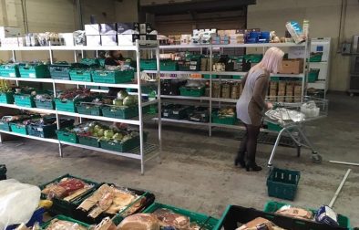 A shopper browses the shelves in the UK’s first food waste supermarket The Real Junk Food Project