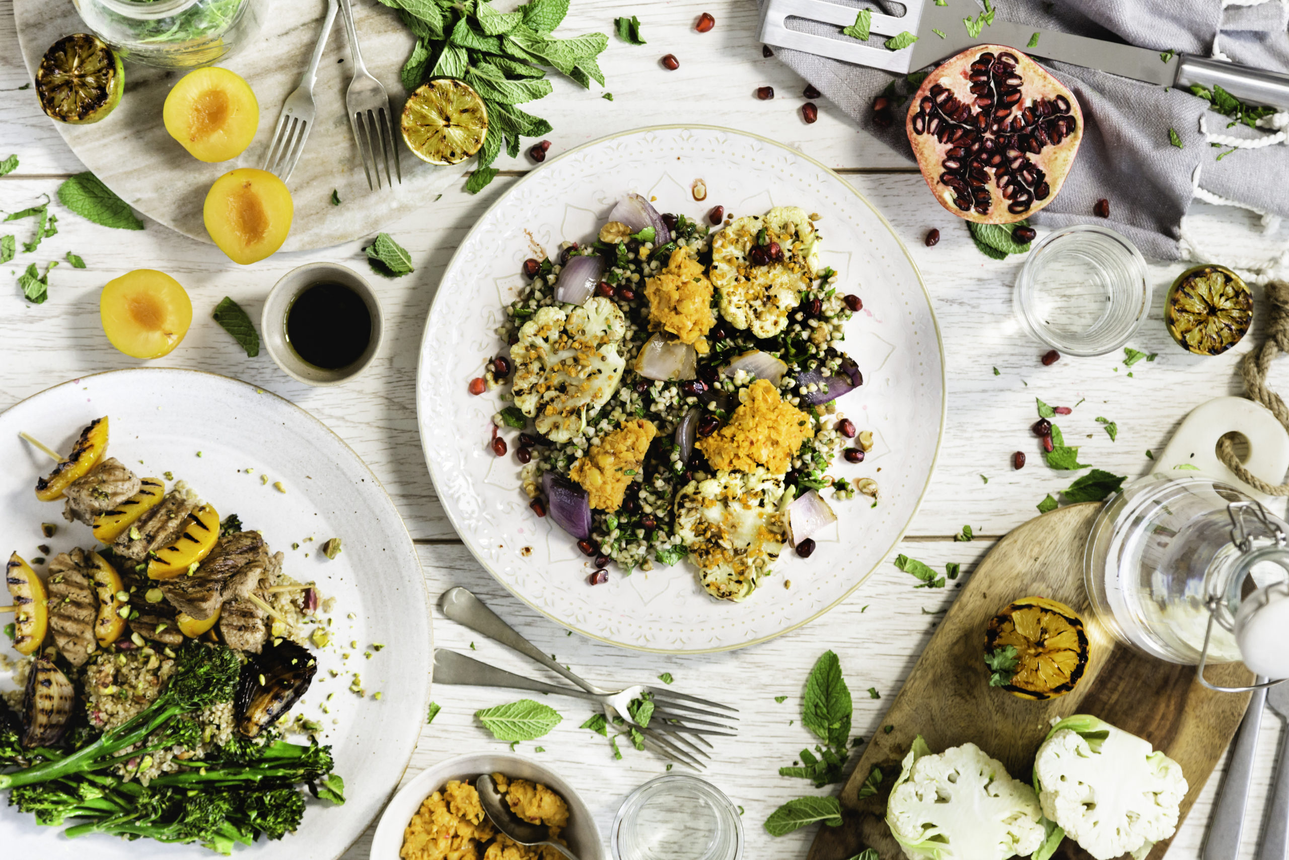 Cauliflower steaks, harissa hummus & walnuts