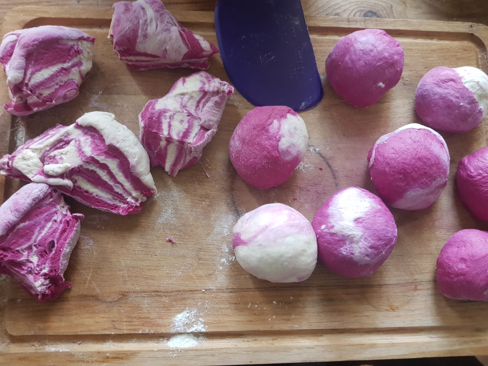 Marbled pink and white dough rough cut and shaped into balls